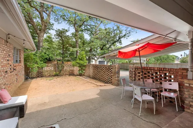 a view of a backyard of the house