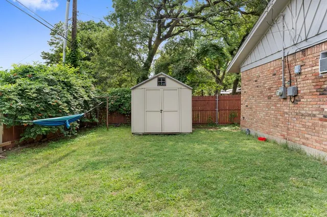 an aerial view of a houses with a lake view