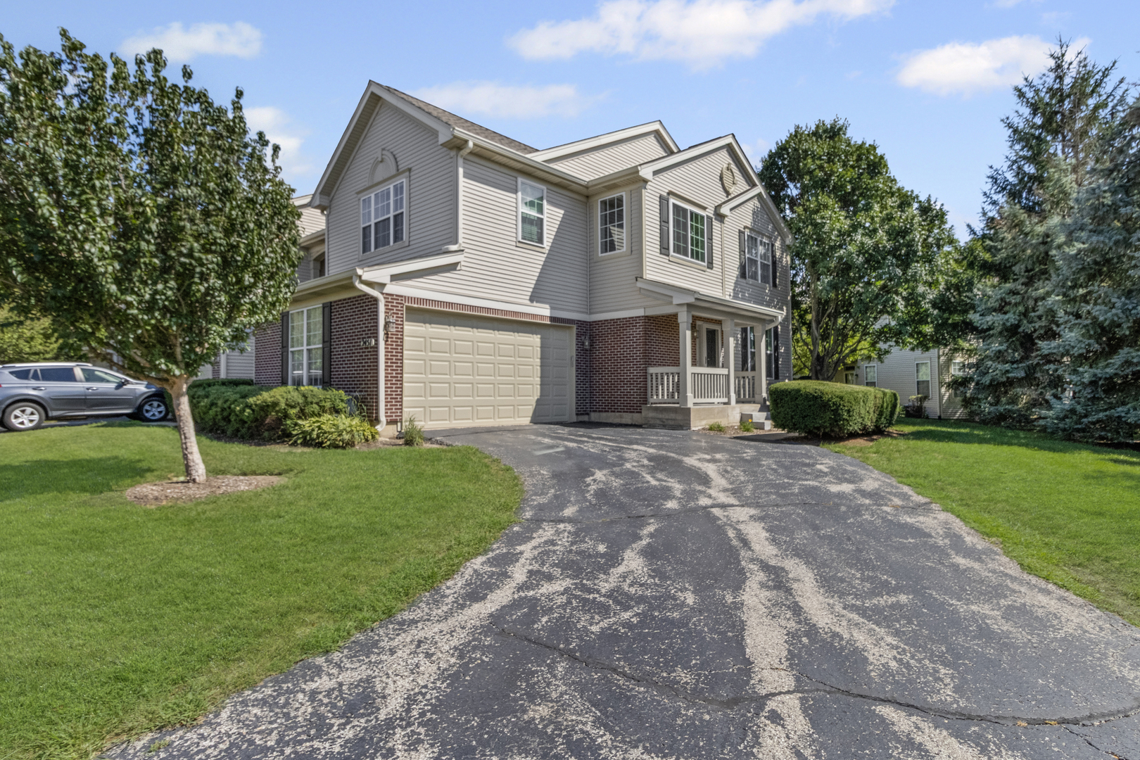 2451 Stonegate Road, Unit 2451 Algonquin, IL 60102 - Photo 1 of 20 a front view of house with yard and green space