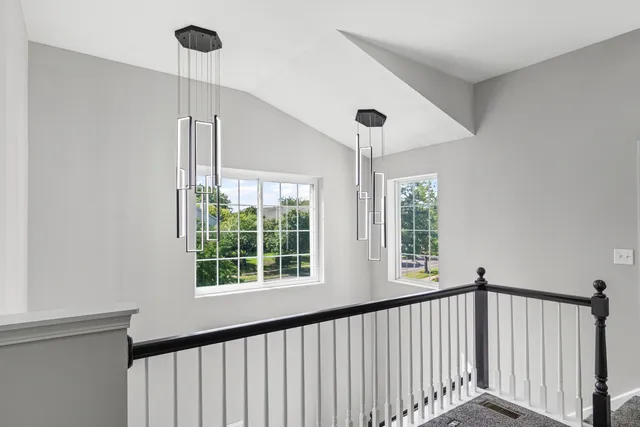 a view of empty room with a window and ceiling fan