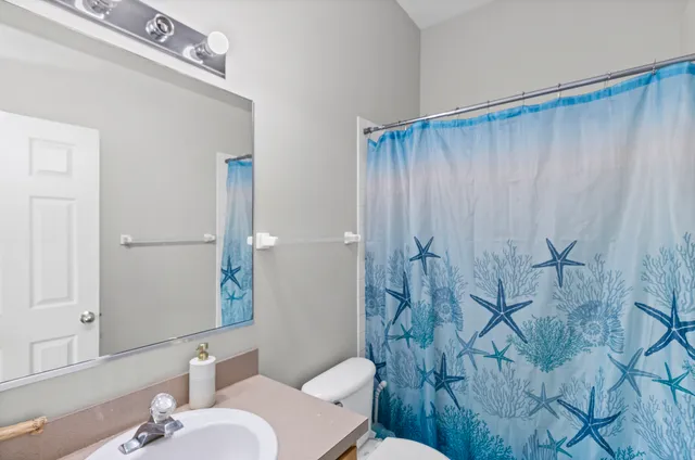 a bathroom with a sink and toilet