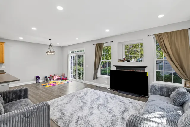 a bedroom with furniture and a fireplace
