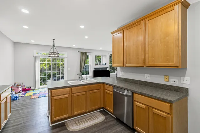 a kitchen with sink cabinets and window