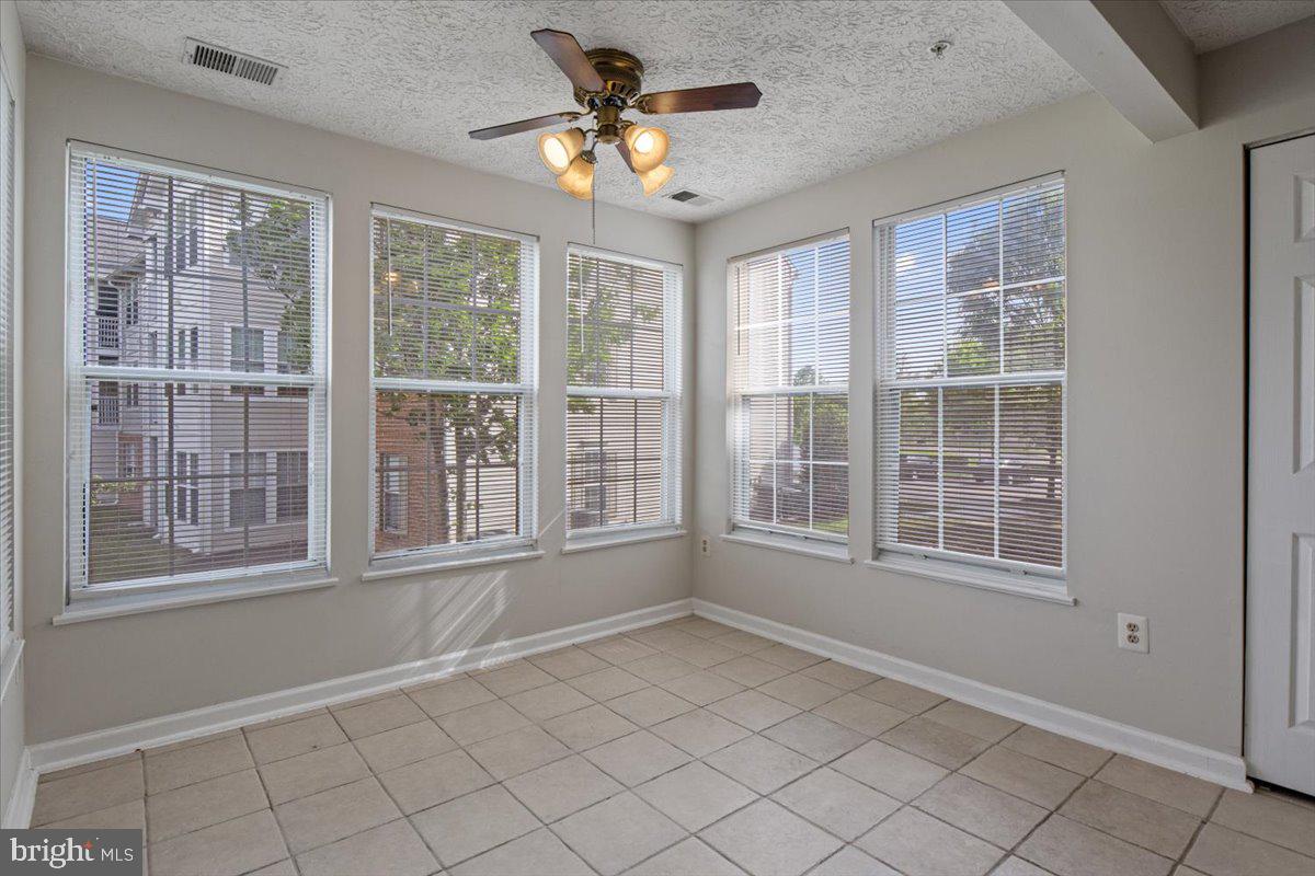2445 Blue Spring Court, Unit 103 Odenton, MD 21113 - Photo 13 of 31 a view of an empty room with a window