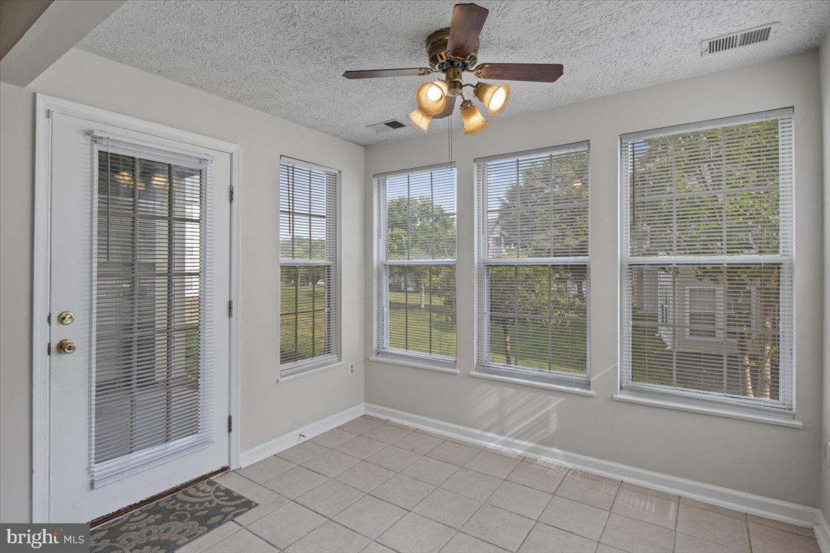 2445 Blue Spring Court, Unit 103 Odenton, MD 21113 - Photo 15 of 31 a view of an empty room with a window