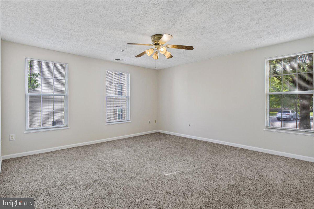 2445 Blue Spring Court, Unit 103 Odenton, MD 21113 - Photo 17 of 31 a view of an empty room with a window