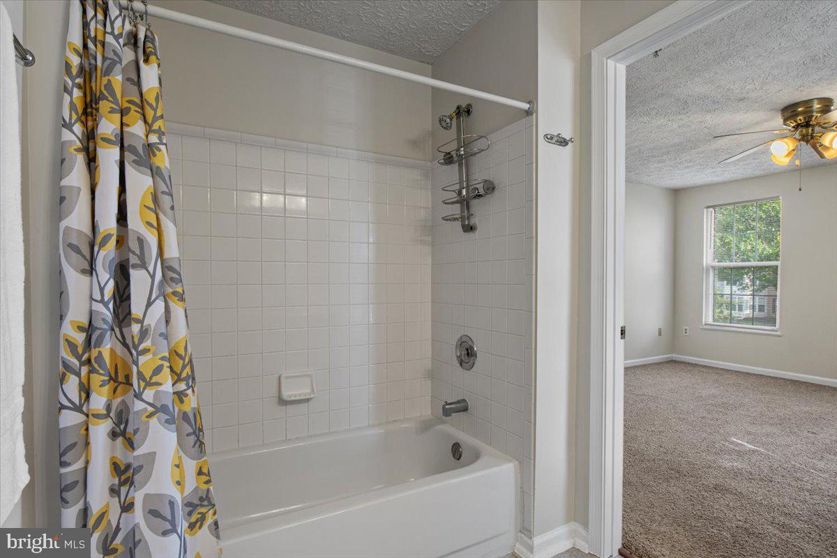 2445 Blue Spring Court, Unit 103 Odenton, MD 21113 - Photo 23 of 31 a bathroom with a bathtub and a shower