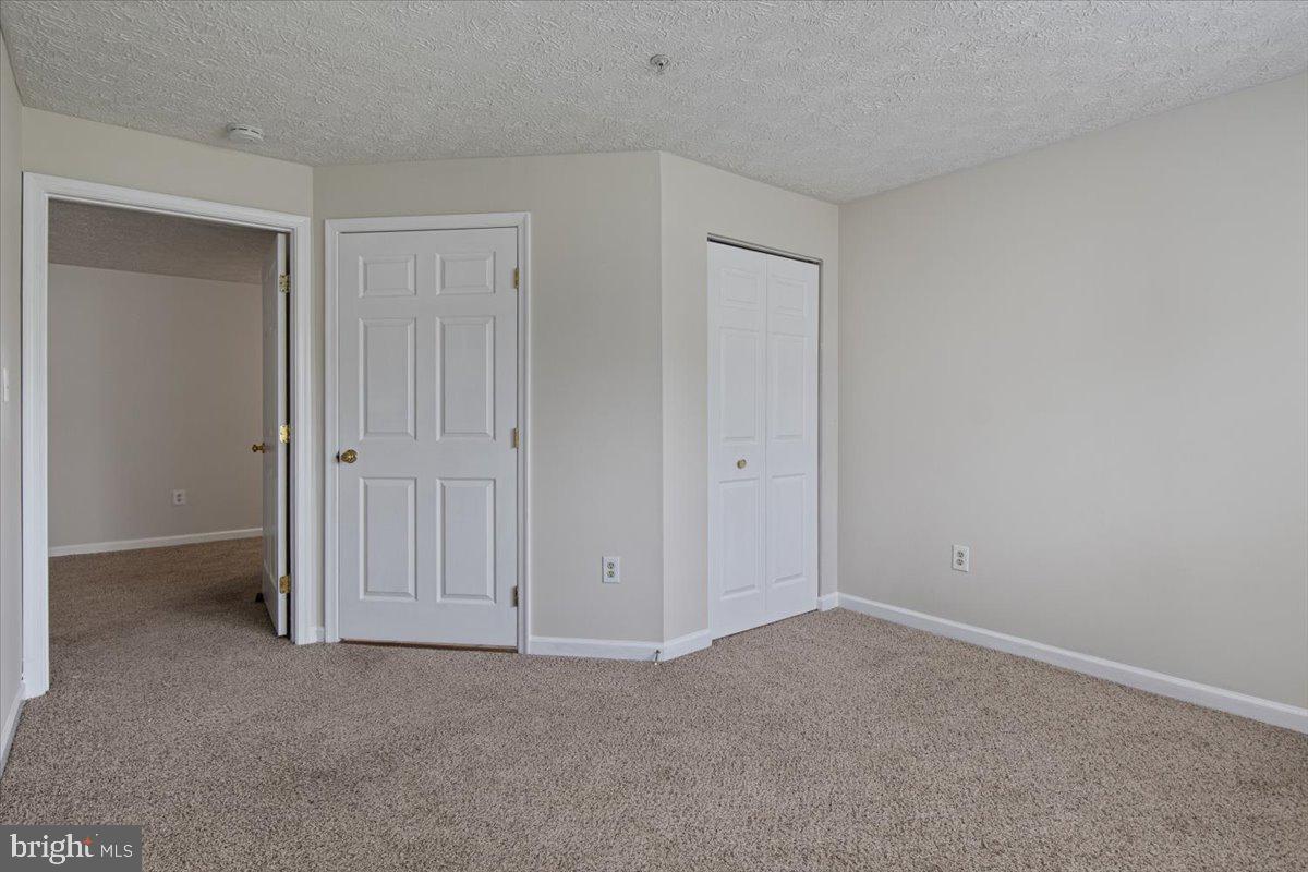 2445 Blue Spring Court, Unit 103 Odenton, MD 21113 - Photo 27 of 31 a view of an empty room