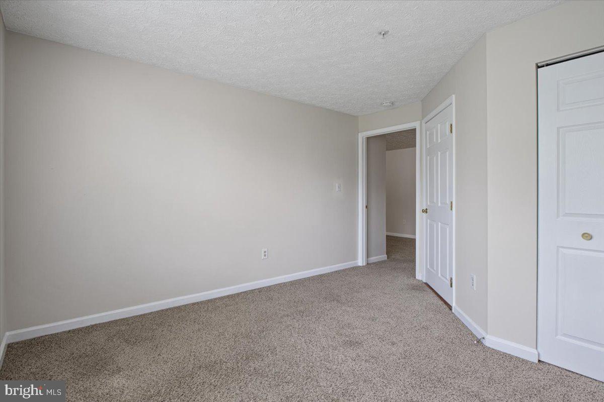 2445 Blue Spring Court, Unit 103 Odenton, MD 21113 - Photo 28 of 31 a view of an empty room