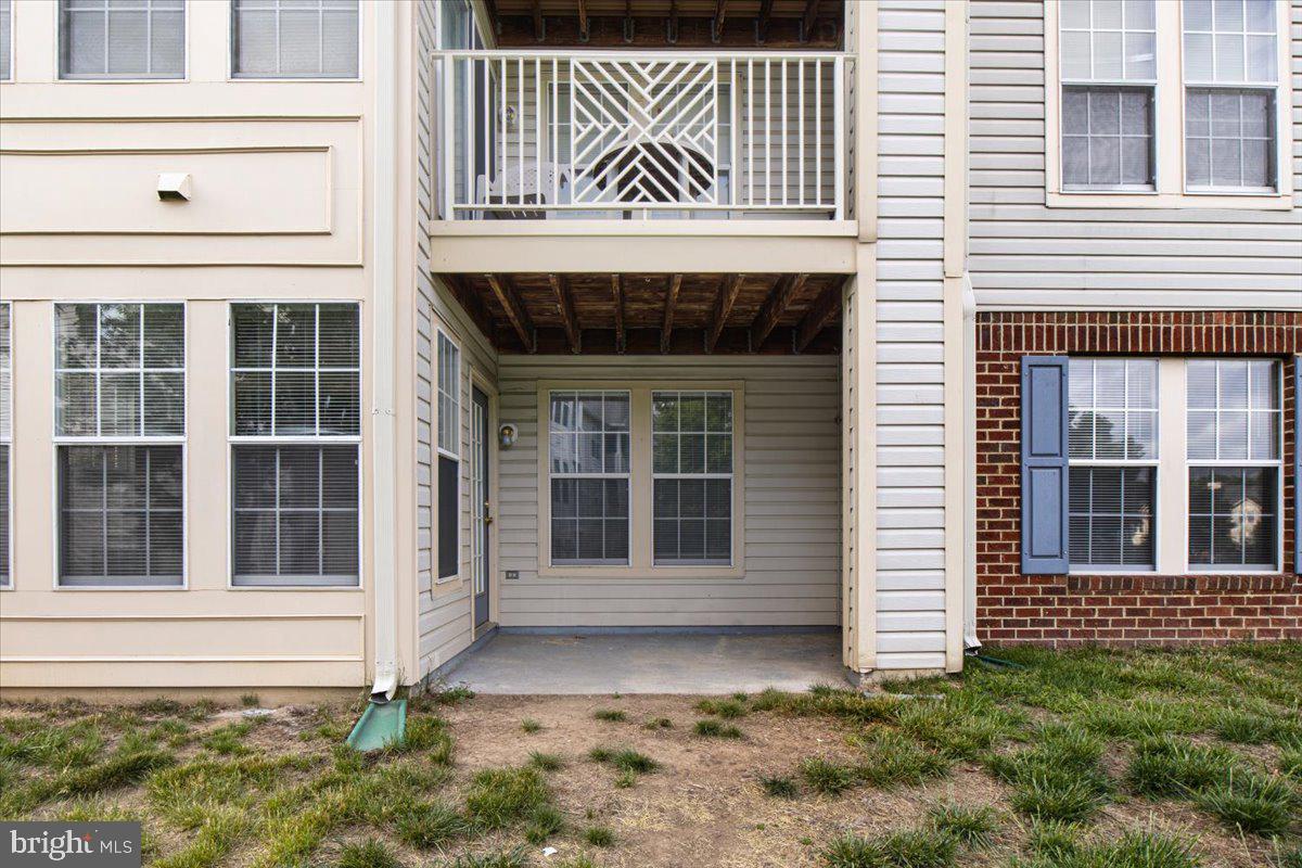 2445 Blue Spring Court, Unit 103 Odenton, MD 21113 - Photo 30 of 31 a front view of a house with a large window
