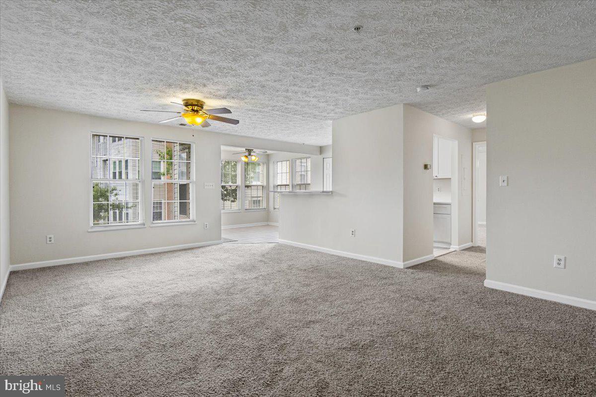 2445 Blue Spring Court, Unit 103 Odenton, MD 21113 - Photo 4 of 31 a view of an empty room with a window