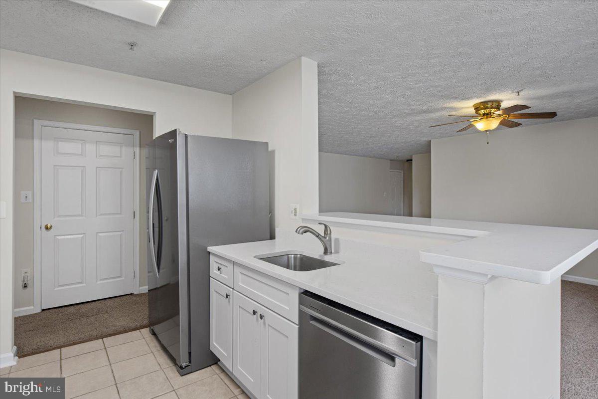 2445 Blue Spring Court, Unit 103 Odenton, MD 21113 - Photo 10 of 31 a bathroom with a sink and a mirror