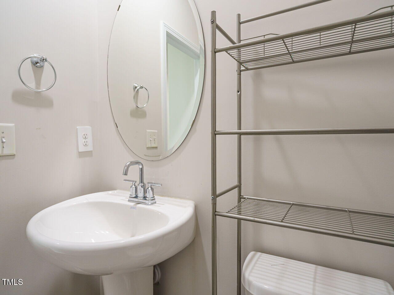 792 Riguard Way Wendell, NC 27591 - Photo 19 of 46 a bathroom with a sink a mirror and a shower