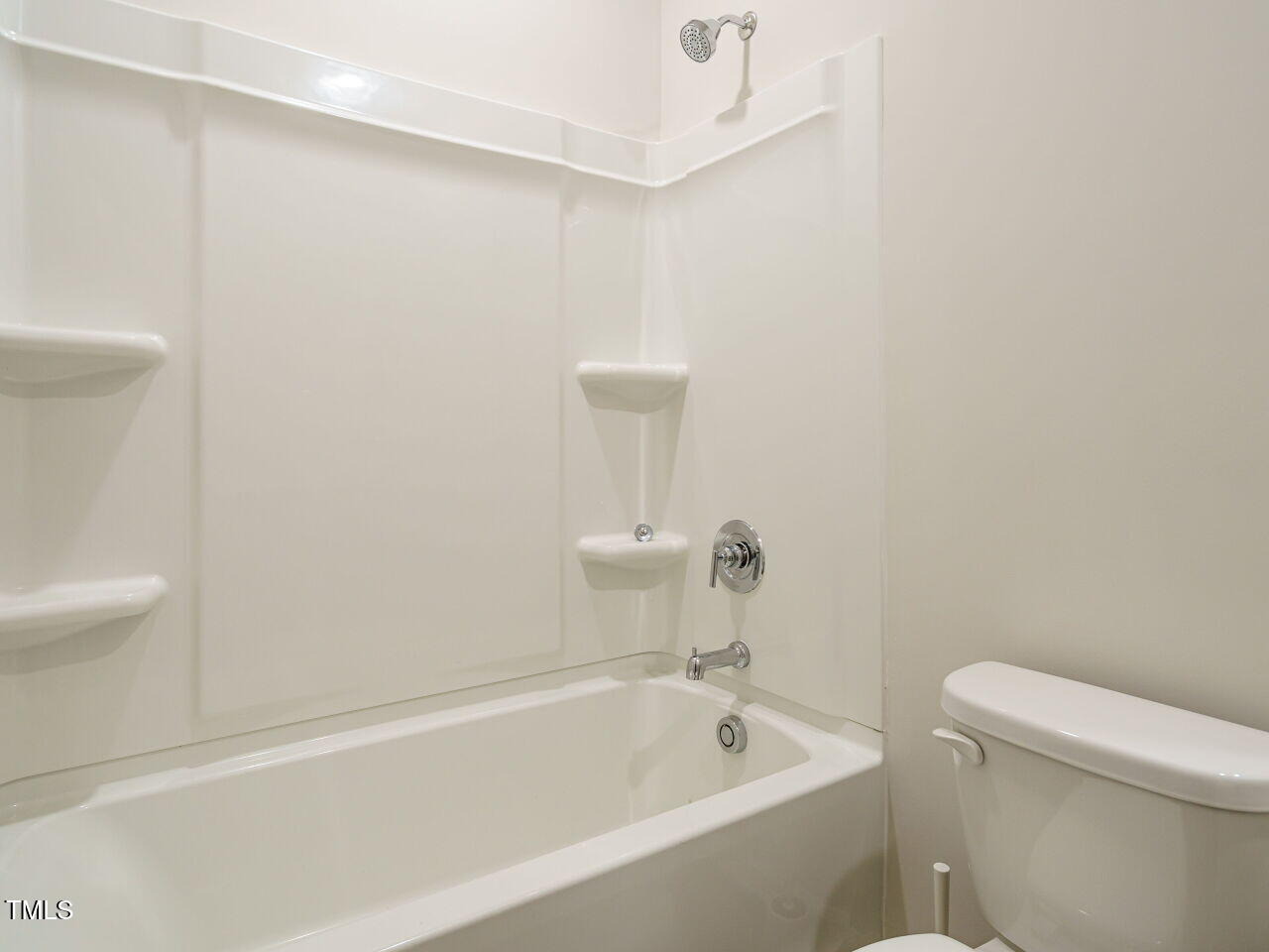 792 Riguard Way Wendell, NC 27591 - Photo 22 of 46 a white bath tub sitting next to a white toilet and sink
