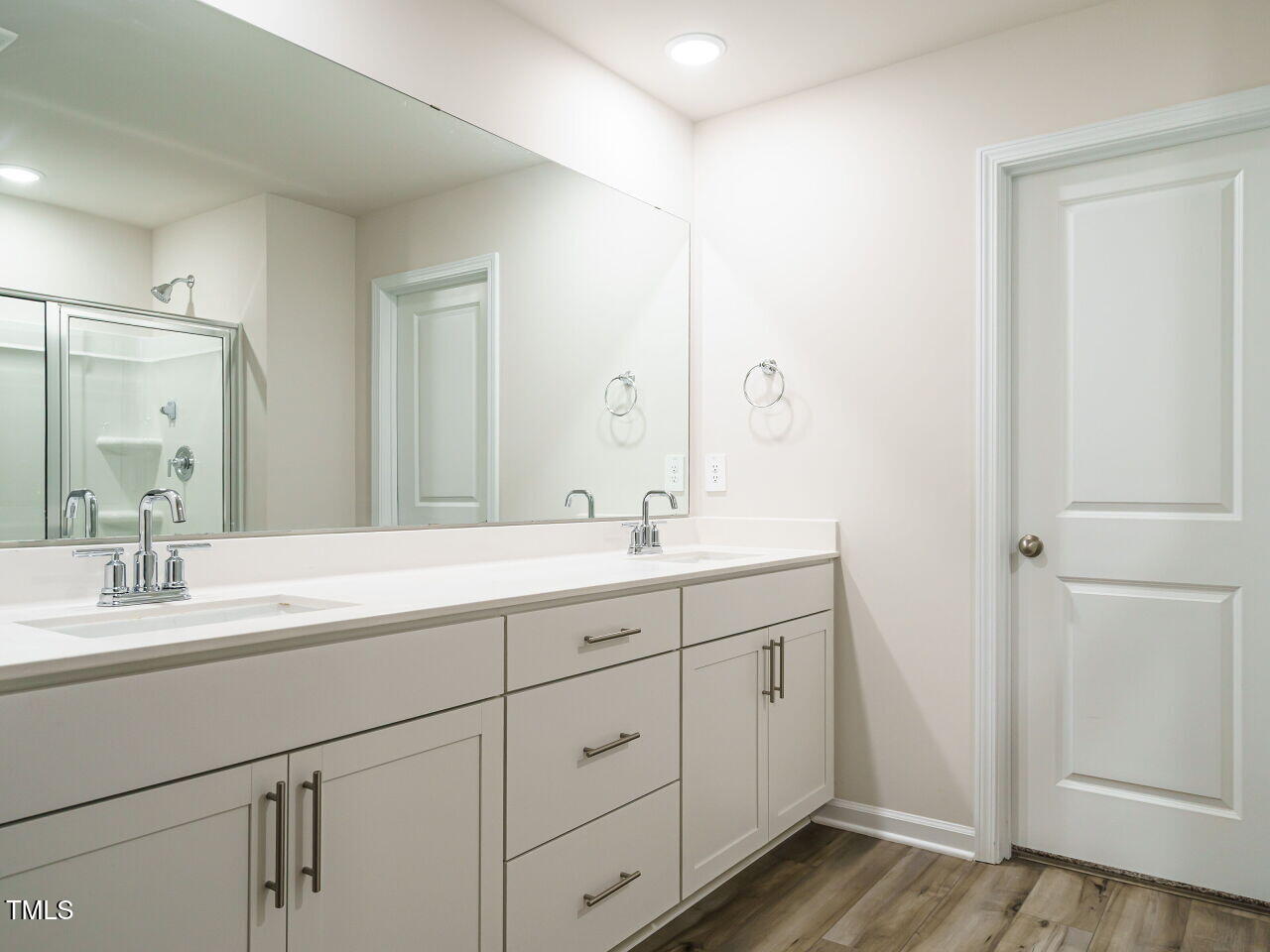 792 Riguard Way Wendell, NC 27591 - Photo 28 of 46 a spacious bathroom with a double vanity sink and mirror