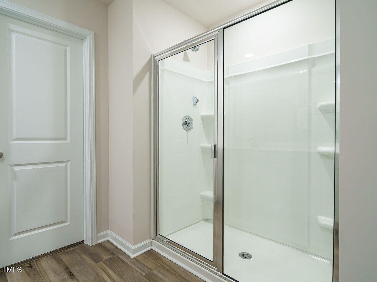 792 Riguard Way Wendell, NC 27591 - Photo 29 of 46 a bathroom with a glass shower door
