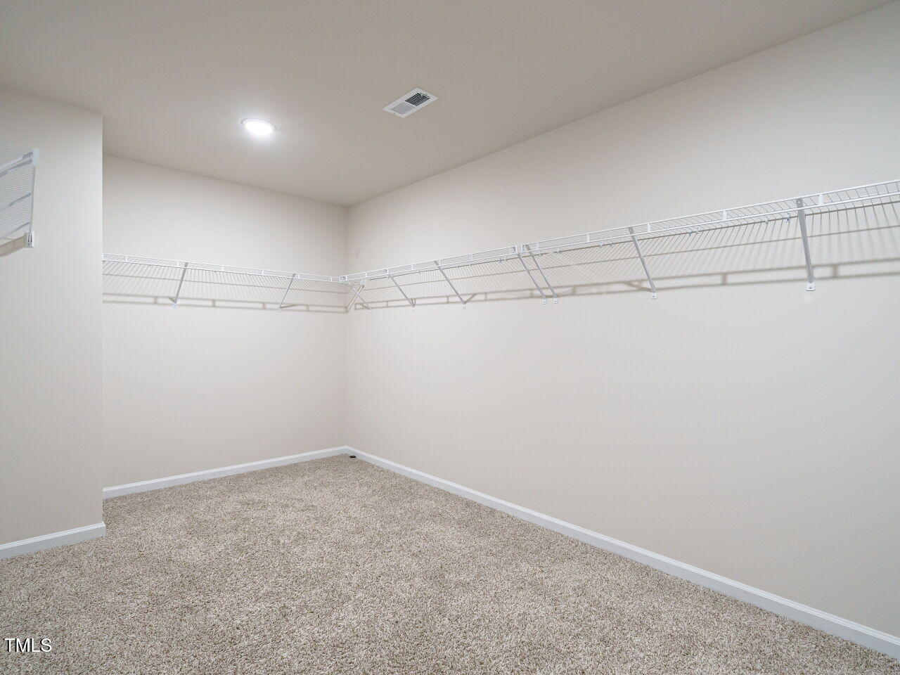 792 Riguard Way Wendell, NC 27591 - Photo 30 of 46 a view of a room with racks on the wall