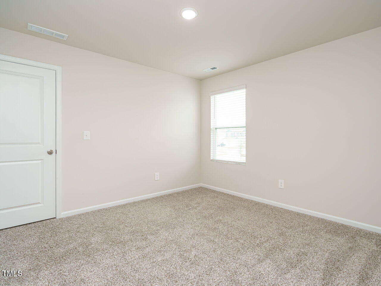 792 Riguard Way Wendell, NC 27591 - Photo 32 of 46 an empty room with a window