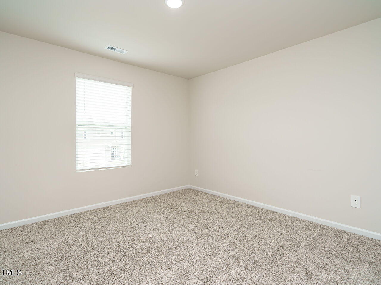 792 Riguard Way Wendell, NC 27591 - Photo 35 of 46 an empty room with a window