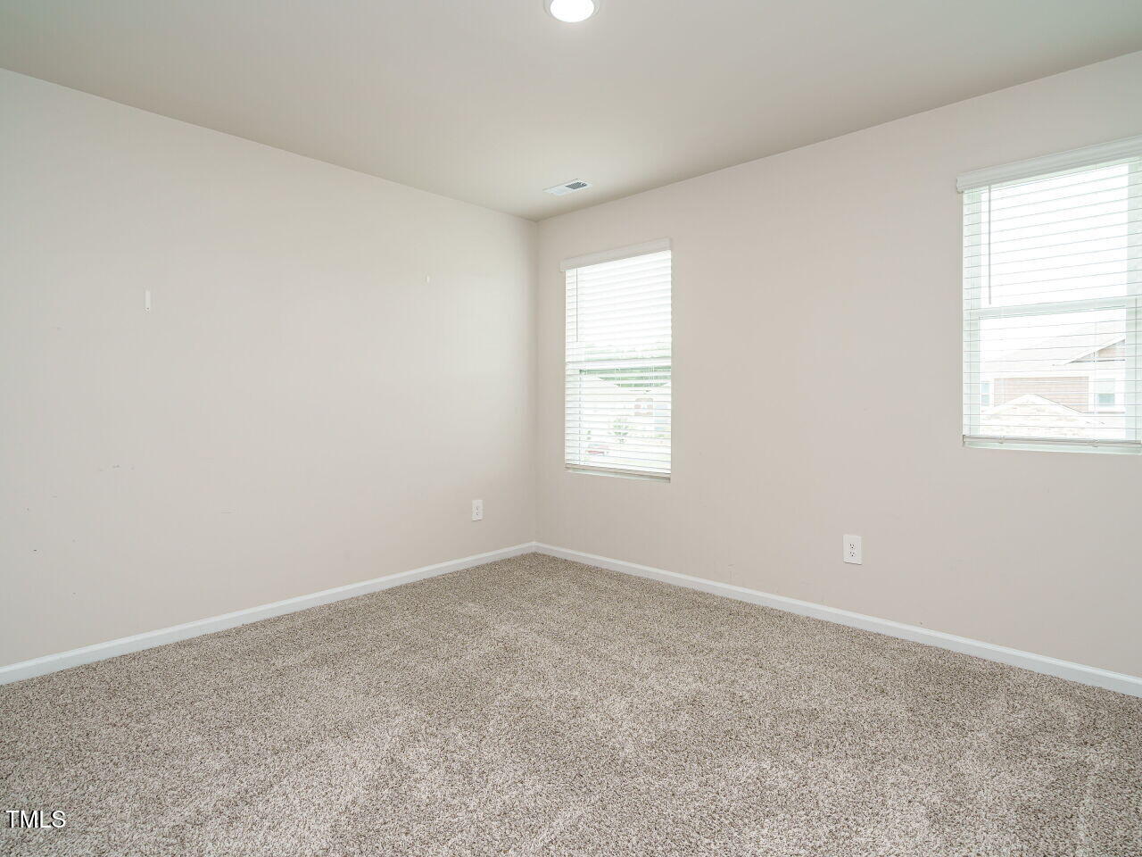 792 Riguard Way Wendell, NC 27591 - Photo 36 of 46 an empty room with windows