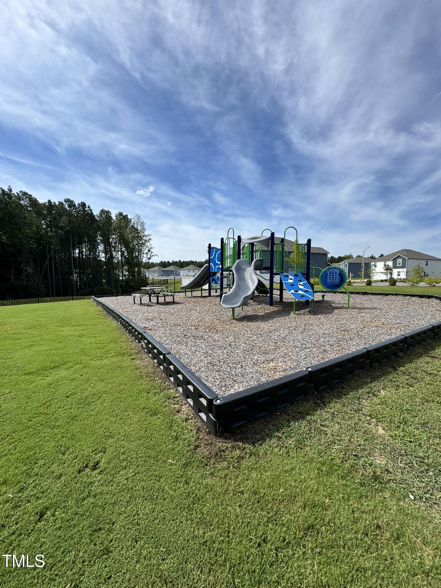792 Riguard Way Wendell, NC 27591 - Photo 39 of 46 a view of a backyard with swimming pool and lawn chairs