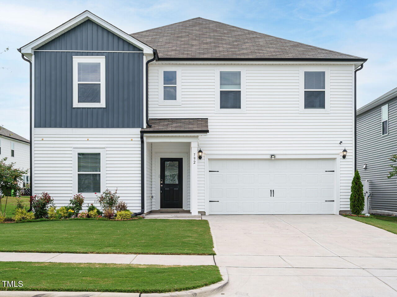 792 Riguard Way Wendell, NC 27591 - Photo 3 of 46 a view of a house with a yard and garage