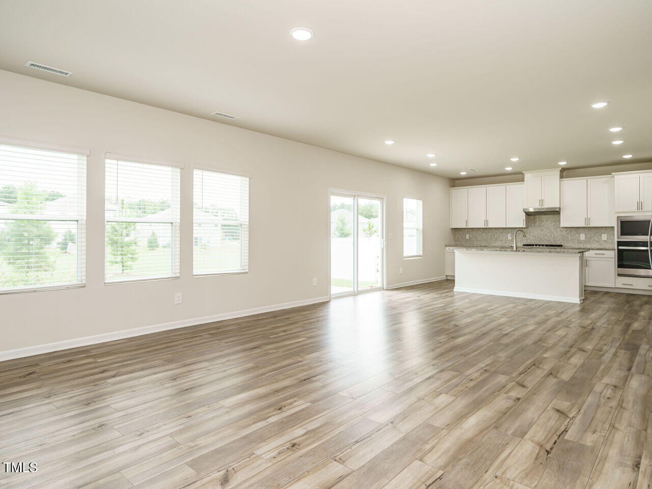 792 Riguard Way Wendell, NC 27591 - Photo 7 of 46 a view of kitchen with wooden floor and window