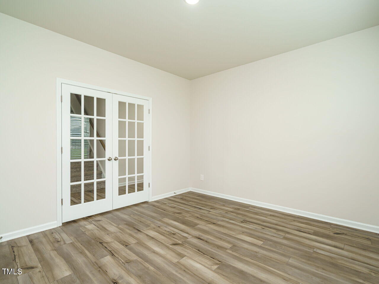 792 Riguard Way Wendell, NC 27591 - Photo 9 of 46 a view of empty room with wooden floor and fan