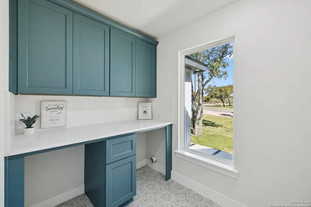 a room with a wooden floor and a window