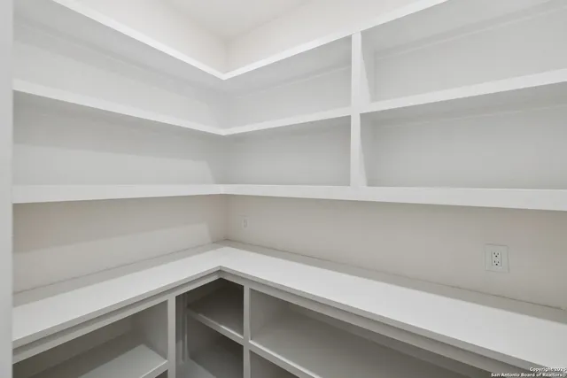 a view of an empty walk in closet