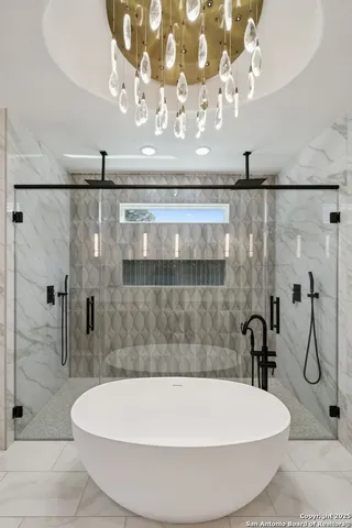 a bathroom with a bathtub and shower