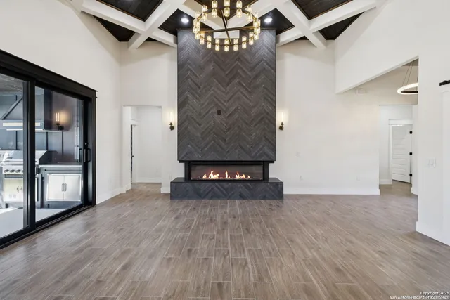 a view of an entryway with wooden floor
