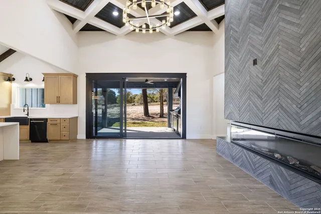 a view of a kitchen with a refrigerator and a sink