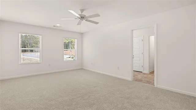 a white bath tub sitting next to a white sink