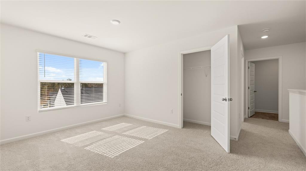 1910 Van Alen Court Dacula, GA 30019 - Photo 27 of 64 a view of an empty room with a window