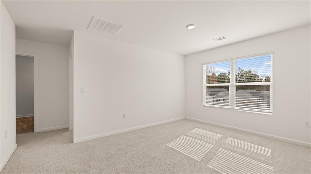 1910 Van Alen Court Dacula, GA 30019 - Photo 28 of 64 a view of an empty room with a window
