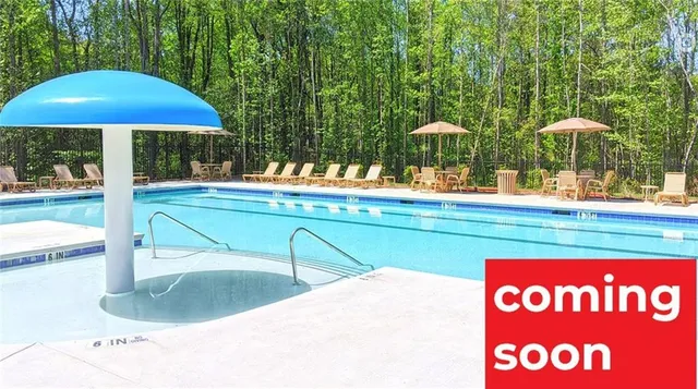 a kitchen with stainless steel appliances granite countertop a sink stove and microwave