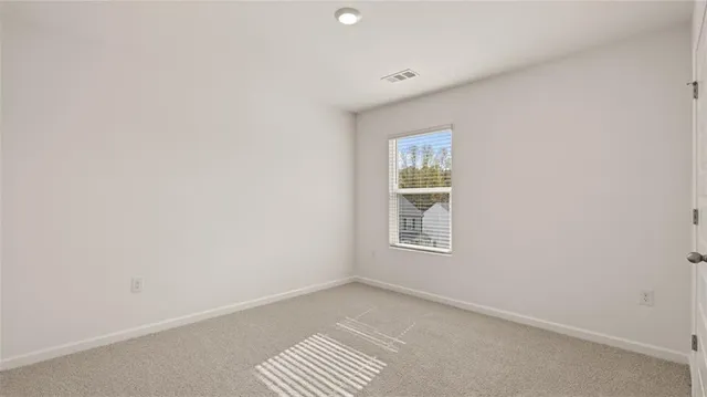 a spacious bathroom with a double vanity sink a mirror and a bathtub