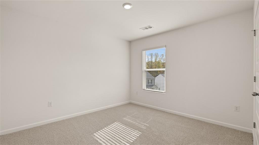 1910 Van Alen Court Dacula, GA 30019 - Photo 31 of 64 an empty room with a window