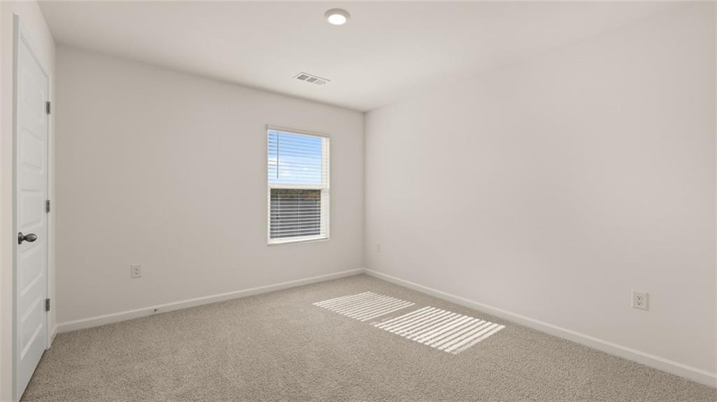 1910 Van Alen Court Dacula, GA 30019 - Photo 33 of 64 a view of an empty room
