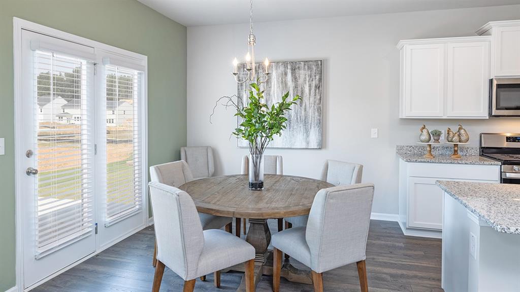 1910 Van Alen Court Dacula, GA 30019 - Photo 37 of 64 a view of a dining room with furniture window and wooden floor