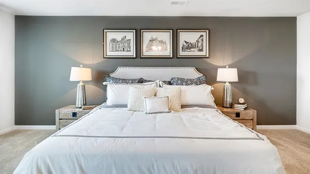 a bedroom with a bed and a mirror