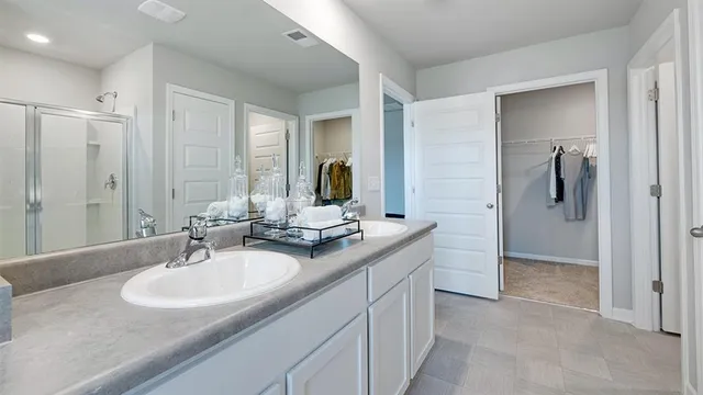 a view of cabinets with stainless steel appliances wooden floor and window