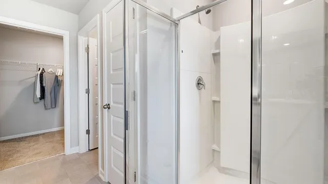 a bedroom with a bed and a table