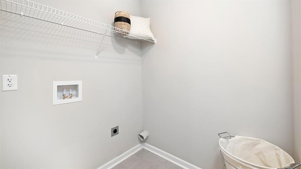 1910 Van Alen Court Dacula, GA 30019 - Photo 63 of 64 a bathroom with a toilet and a shower