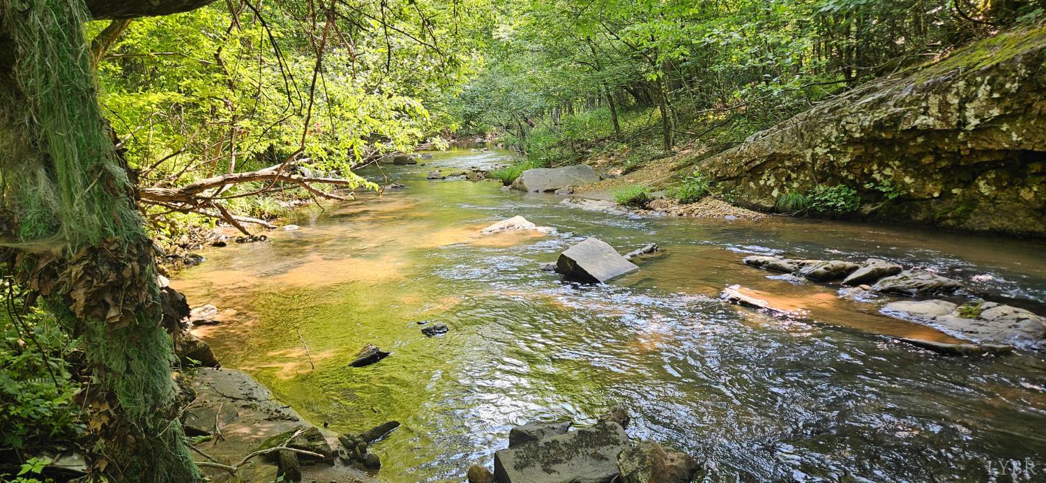 a view of outdoor space with a lake view