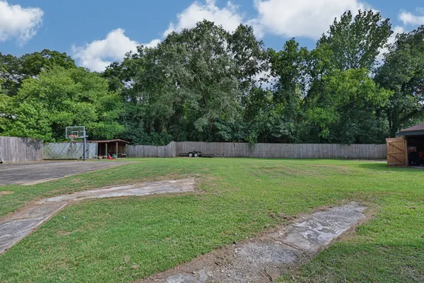 a view of a tiny house with a yard