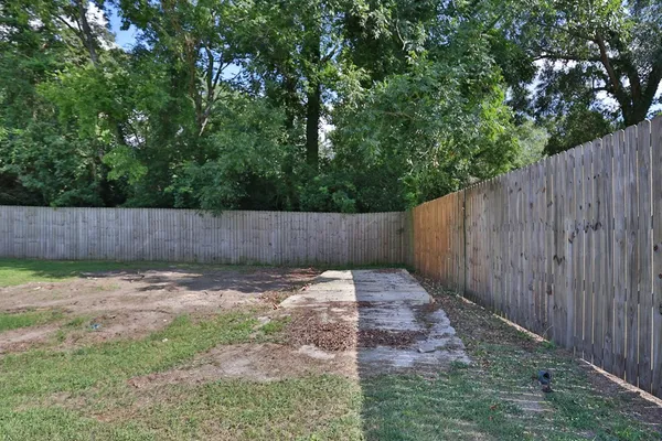 a view of outdoor space with wooden fence