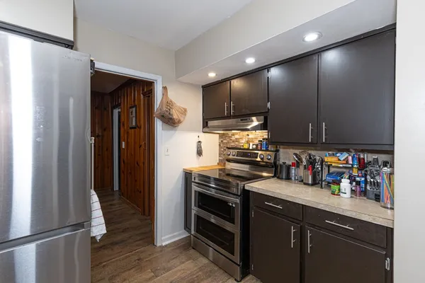 a kitchen with stainless steel appliances a refrigerator and a sink