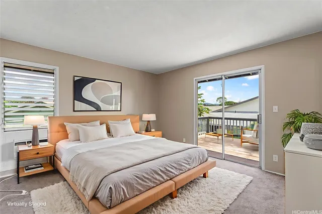 a bedroom with a large bed and a large window